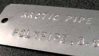 Arctic Pipe embossed tag